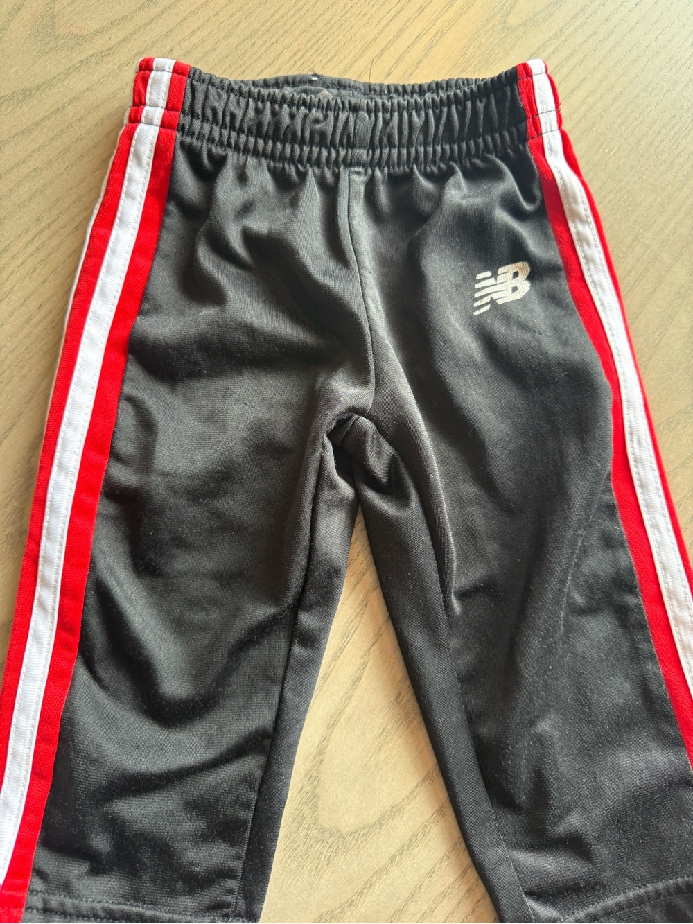 New Balance Kids Black Sweatpants with Red & White Side Stripes